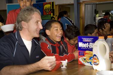 Breakfast cheer: Sanitarium General Manager Pierre van Heerden with Wesley Intermediate students